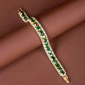 Bracciale dorato con gemme verdi