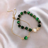 Set di bracciali con gemme verdi